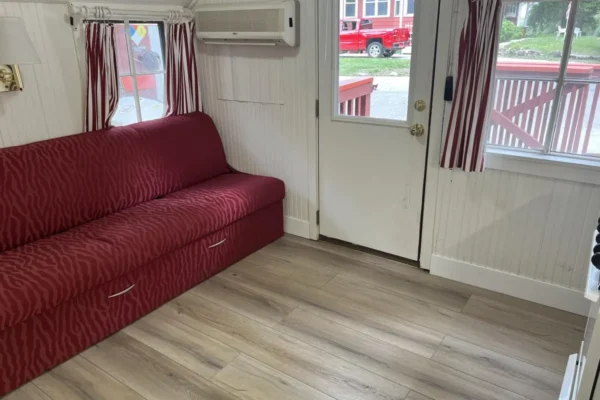 View of the sofa sleeper in the main room, opposite of the kitchen