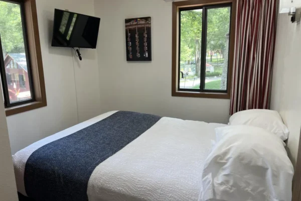 View of the first bedroom with a queen bed