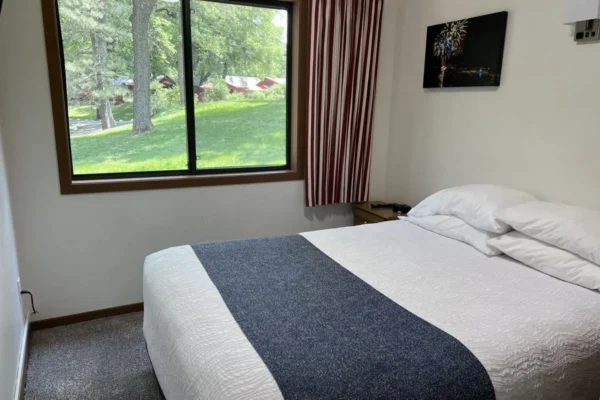 View of the second bedroom with a queen bed