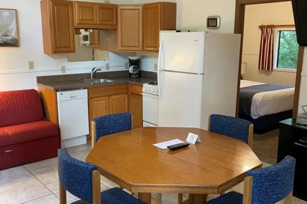 View of the kitchen and dining area with a sofa sleeper