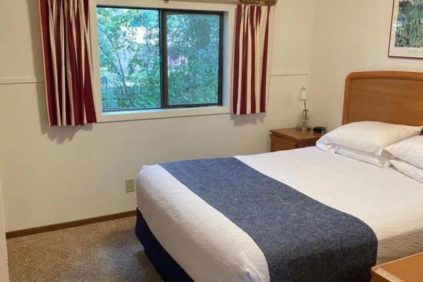 View of one of the bedrooms with a queen bed